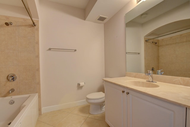 full bathroom with tiled shower / bath combo, vanity, toilet, and tile patterned flooring