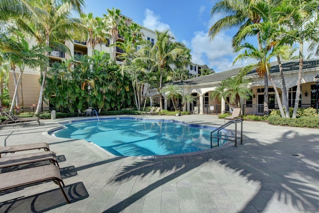 view of swimming pool featuring a patio