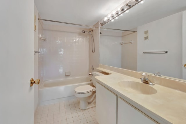 full bathroom with tile patterned floors, toilet, tiled shower / bath combo, and vanity