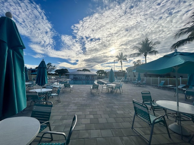view of patio featuring fence