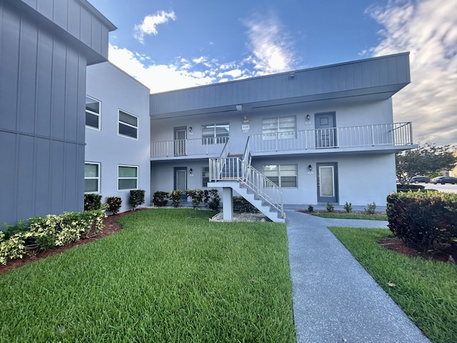 view of property featuring stairs