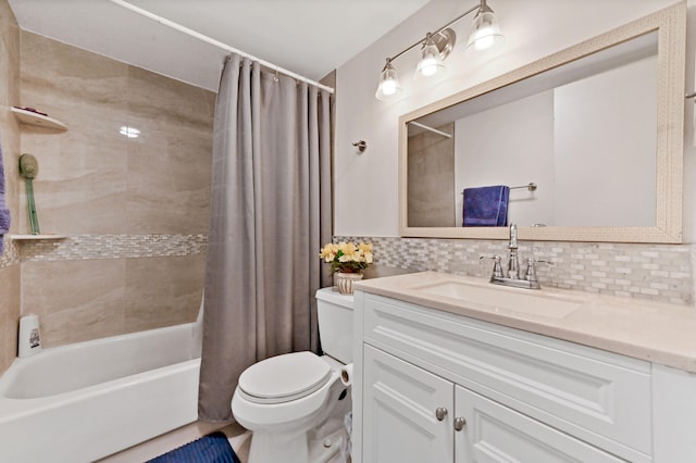 full bathroom featuring toilet, tasteful backsplash, vanity, and shower / tub combo