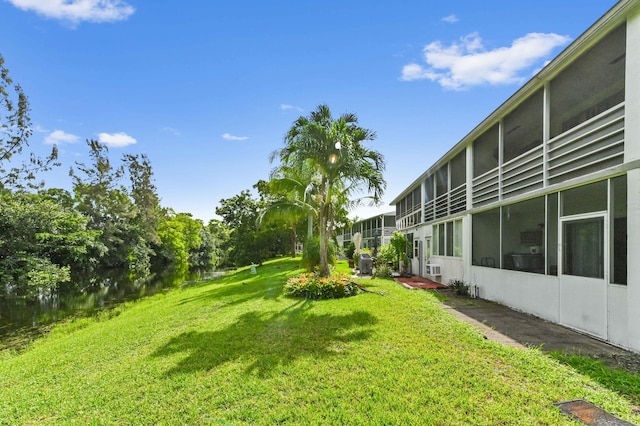 view of yard with a sunroom