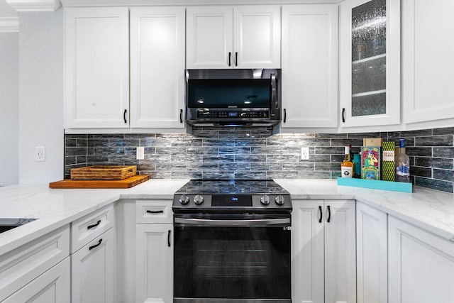 kitchen with white cabinets and appliances with stainless steel finishes