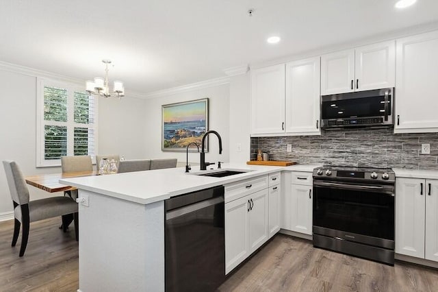 kitchen featuring kitchen peninsula, white cabinetry, and stainless steel appliances