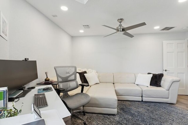 interior space with ceiling fan and dark hardwood / wood-style floors