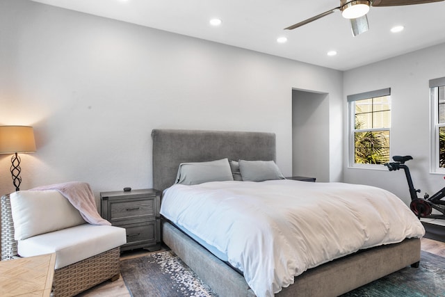 bedroom with ceiling fan and hardwood / wood-style floors