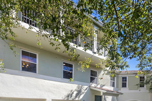 view of side of home with a balcony