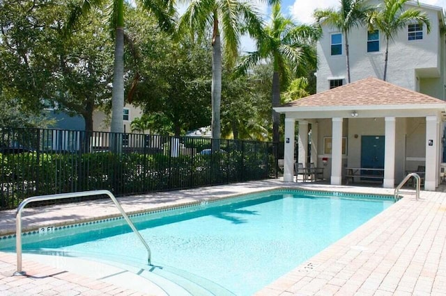 view of swimming pool with a patio