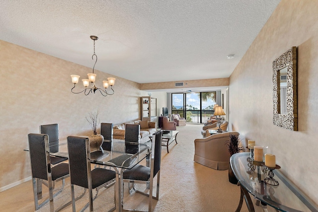 carpeted dining space featuring a textured ceiling and a notable chandelier