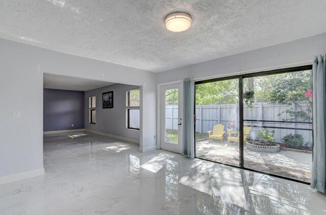 empty room with a textured ceiling