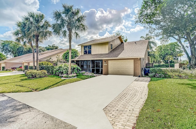 view of front of property featuring a garage and a front yard