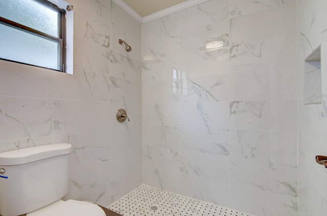 bathroom featuring crown molding, toilet, and tiled shower