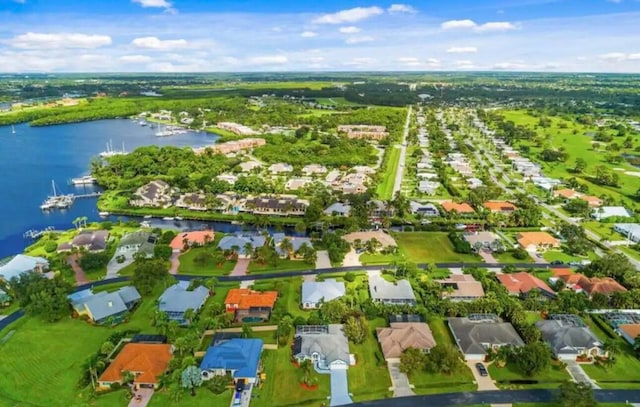 aerial view featuring a water view and a residential view