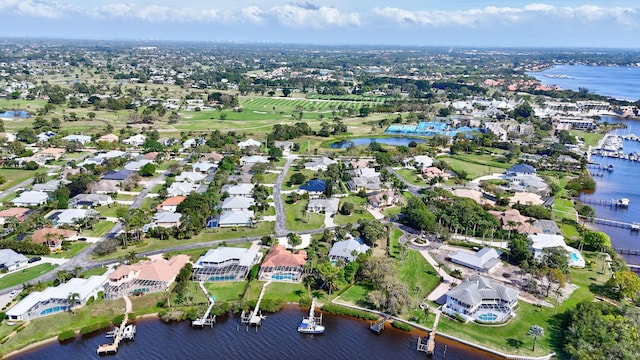 drone / aerial view featuring a water view and a residential view