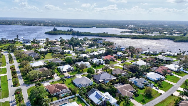 bird's eye view with a water view and a residential view