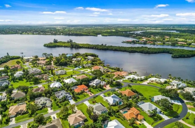 bird's eye view with a residential view and a water view