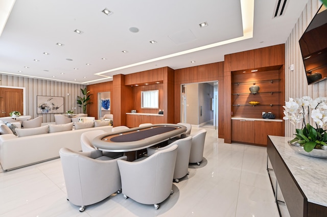 interior space featuring wood walls and light tile patterned flooring