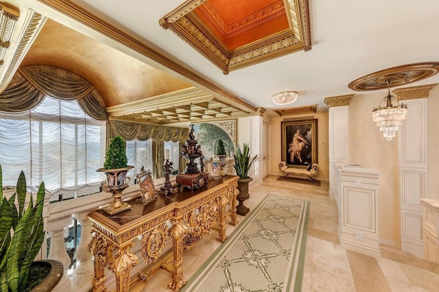 hallway featuring ornamental molding and an inviting chandelier