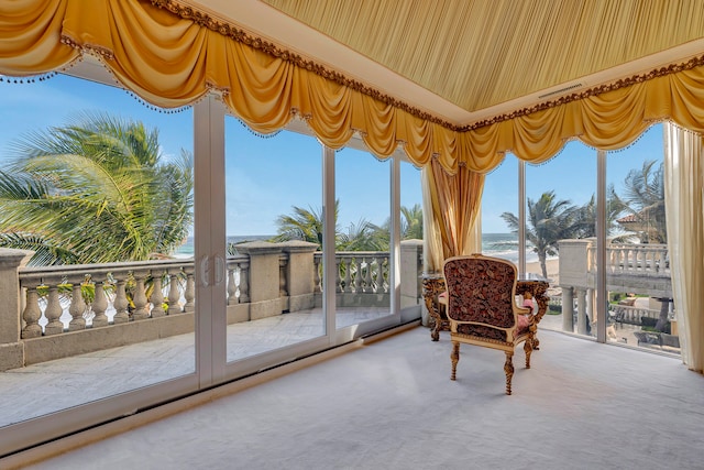 sunroom / solarium with a water view