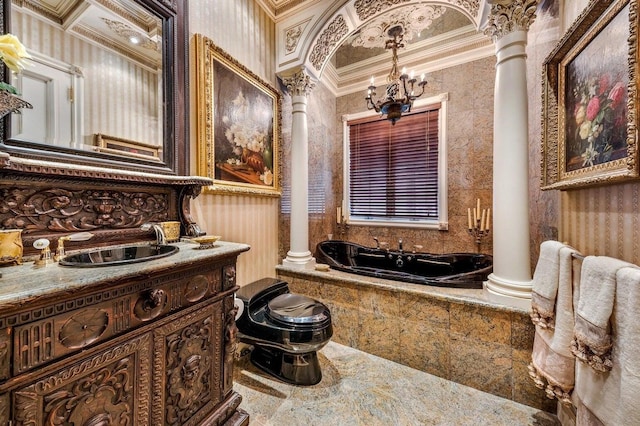 bathroom with tiled tub, crown molding, and decorative columns