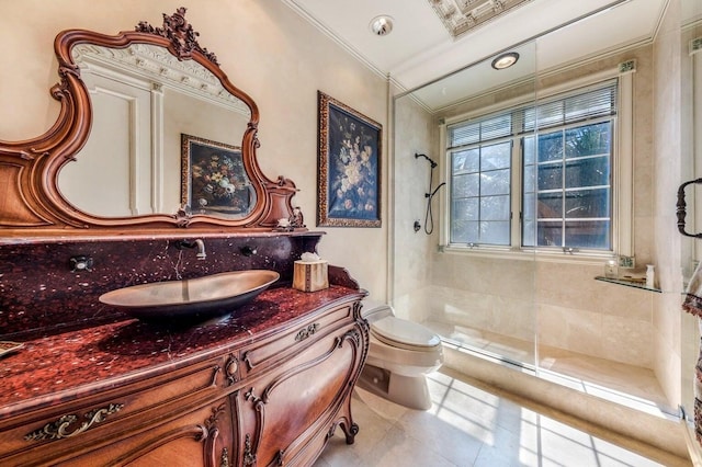 bathroom featuring vanity, walk in shower, tile patterned flooring, ornamental molding, and toilet