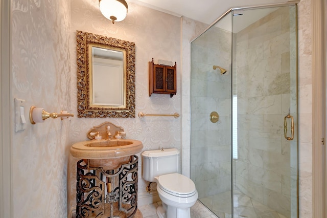 bathroom featuring a shower with door, vanity, and toilet