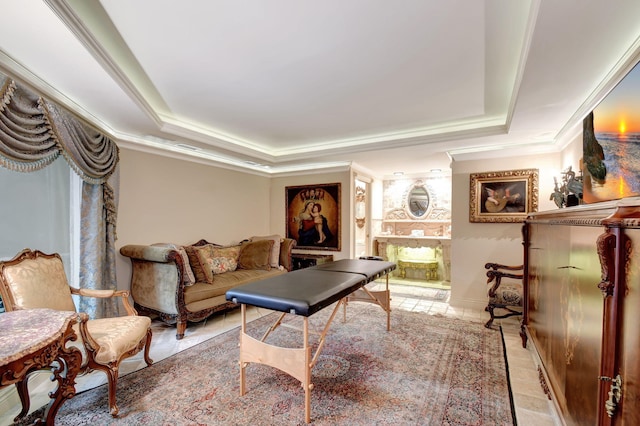 living room with a raised ceiling and crown molding