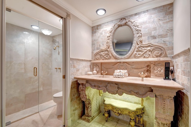 bathroom featuring tile walls, walk in shower, ornamental molding, toilet, and sink