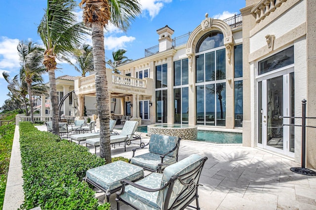 view of patio featuring a balcony