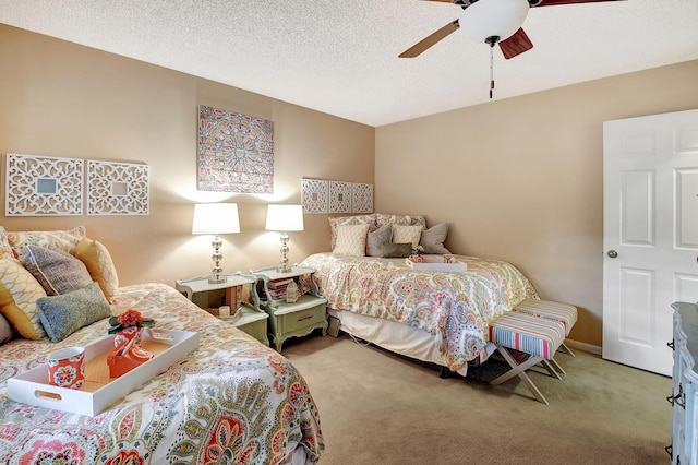 carpeted bedroom with a textured ceiling and ceiling fan