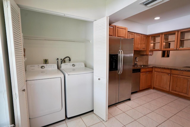2121 S Ocean Blvd Unit 804, Lauderdale By The Sea, FL 33062 - laundry area with washing machine and dryer and light tile patterned floors