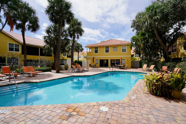 view of swimming pool with a patio