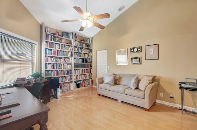 office featuring high vaulted ceiling, light hardwood / wood-style floors, and ceiling fan