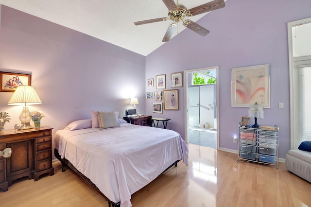 bedroom featuring light hardwood / wood-style flooring, ceiling fan, and high vaulted ceiling