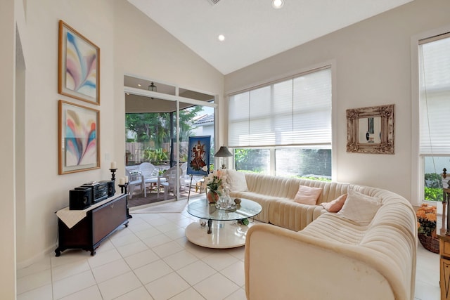 living room with vaulted ceiling and light tile patterned flooring