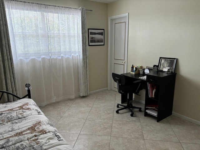 bedroom featuring light tile patterned floors