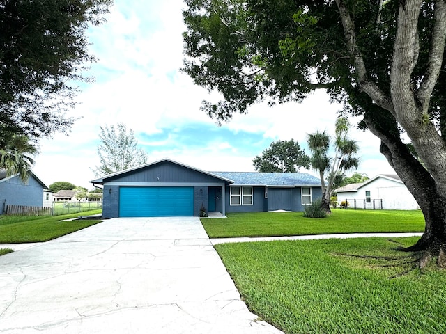 ranch-style house with a front lawn and a garage