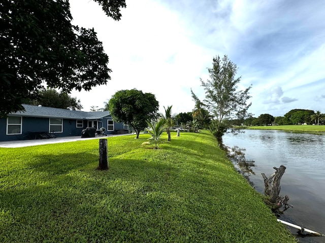 exterior space with a water view