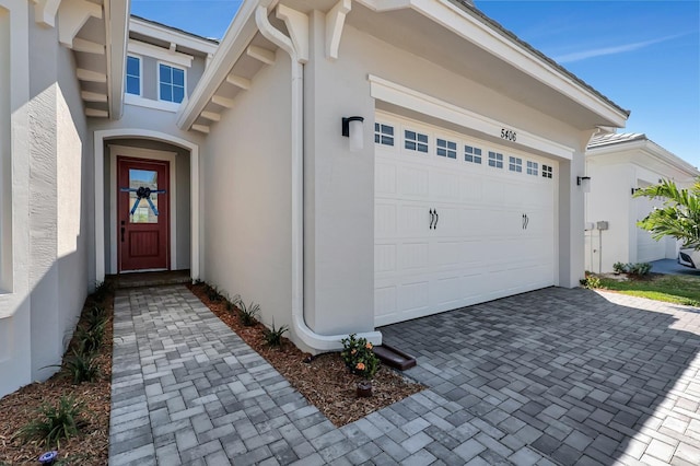 doorway to property featuring a garage