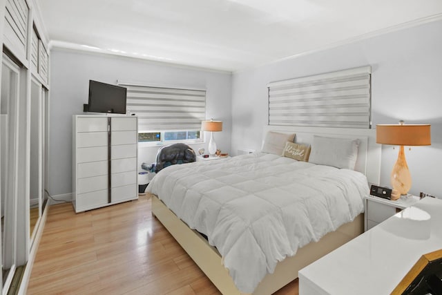 bedroom with light wood finished floors