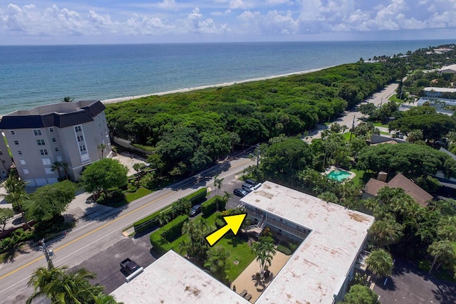 bird's eye view featuring a beach view and a water view