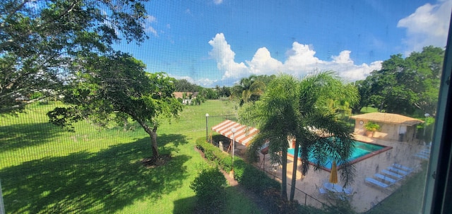 exterior space featuring a yard and a pool