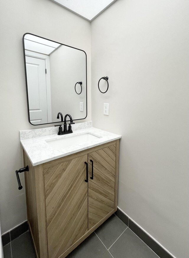 bathroom with vanity and tile patterned floors