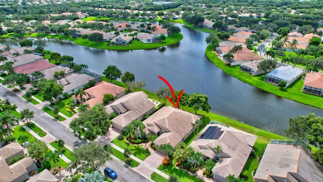 birds eye view of property featuring a water view