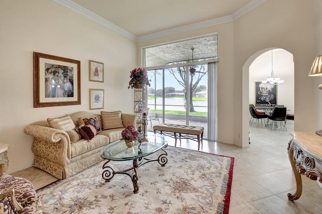 tiled living room with a chandelier and ornamental molding