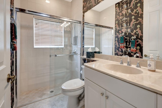 bathroom with an enclosed shower, tile patterned flooring, toilet, and vanity