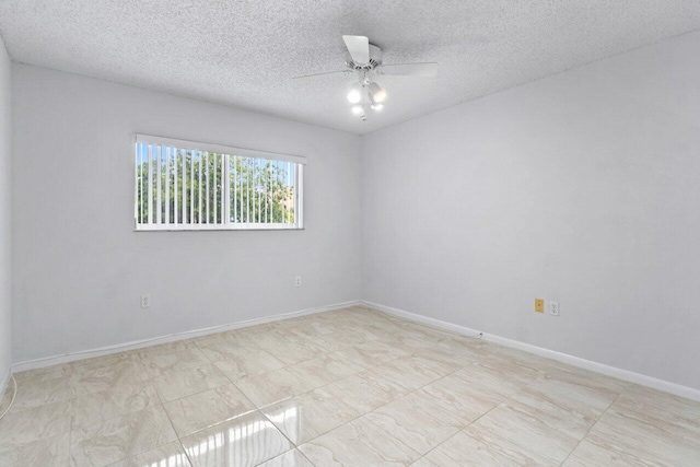 unfurnished room with a textured ceiling and ceiling fan