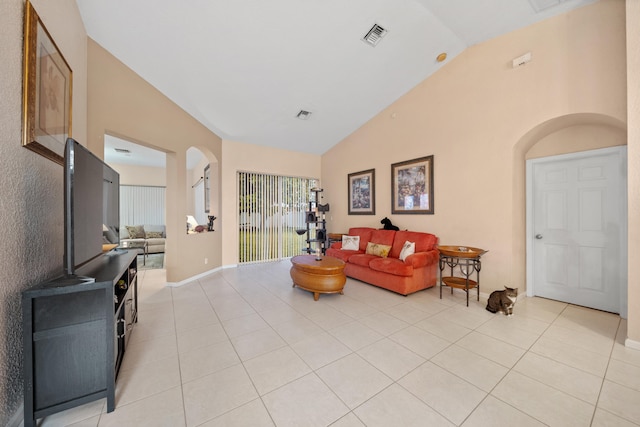 tiled living room with vaulted ceiling