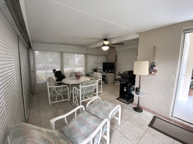 sunroom / solarium with ceiling fan